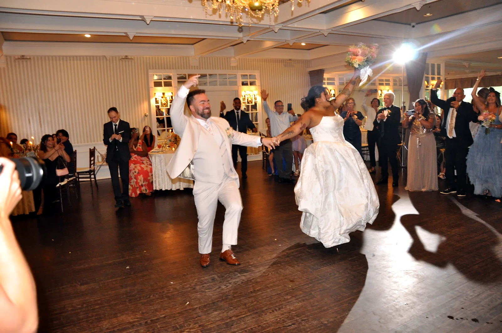 Newlyweds’ grand entrance announced by their MC at a Long Island wedding